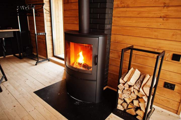 fireplace with woods modern wooden house